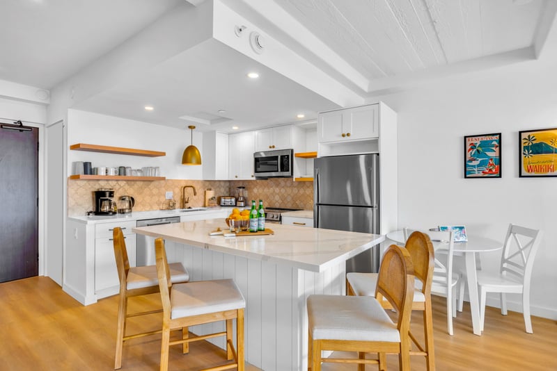 Cook, sip, and savor in this spacious open-concept kitchen and dining area.