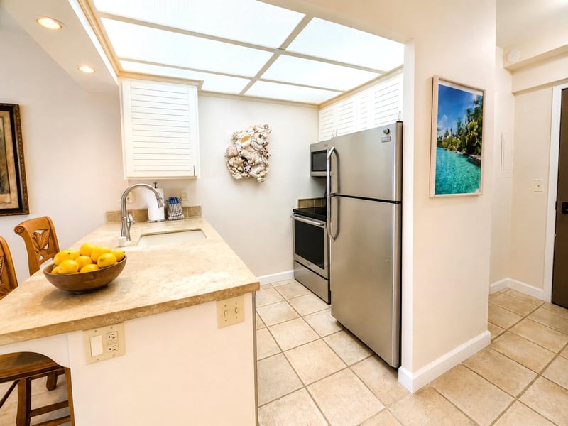 The kitchen features spacious counter tops and updated appliances for convenience WH2-465