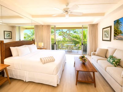 Comfortable king bed with tropical resort ambiance