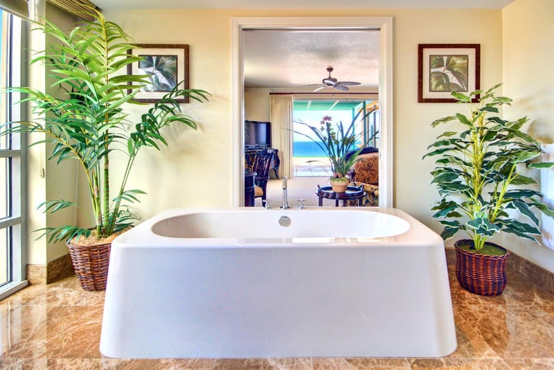 A freestanding tub and tropical touches set the tone for deep relaxation

