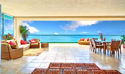 Oceanfront terrace with panoramic views, ideal for luxury dining, lounging, and unforgettable sunsets daily