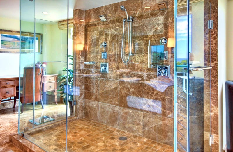 Opulent marble walk-in shower with rainfall head and body jets—your spa-level experience begins right here    