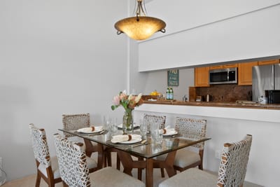 Step into a dining dream where safari-chic chairs meet golden-glow chandeliers and tropical blooms whisper aloha GCH-120