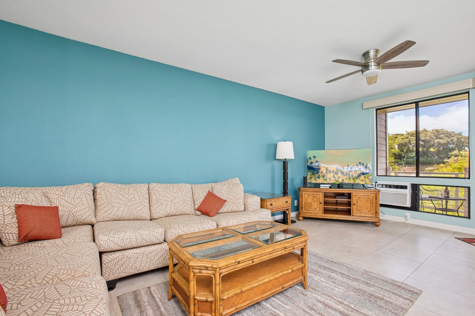 Cozy open-concept living area with a sectional sofa and easy access to the lanai GCH-121