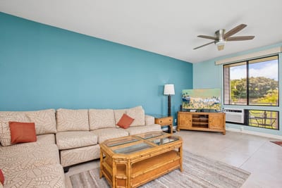 Cozy open-concept living area with a sectional sofa and easy access to the lanai
