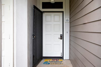 Front door entrance with keyless entry and welcome mat