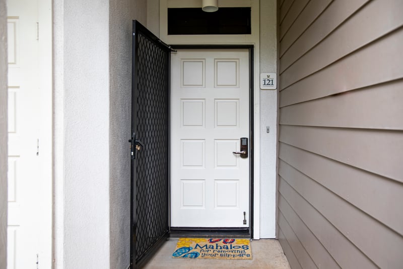 Front door entrance with keyless entry and welcome mat