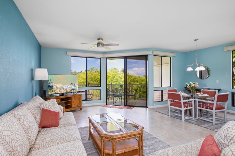 Spacious living room with plenty of seating and natural light for relaxing after beach adventures