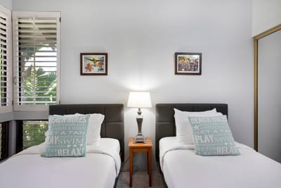 Ideal for kids or extra guests, this room offers two twin beds in a cheerful setting