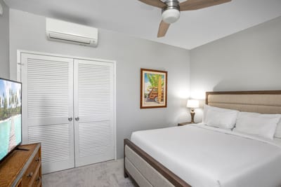 A cozy third bedroom with a queen bed ensures restful nights for guests