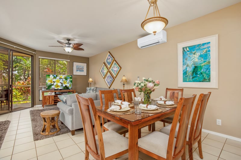Warm dining area with seating for six and garden views