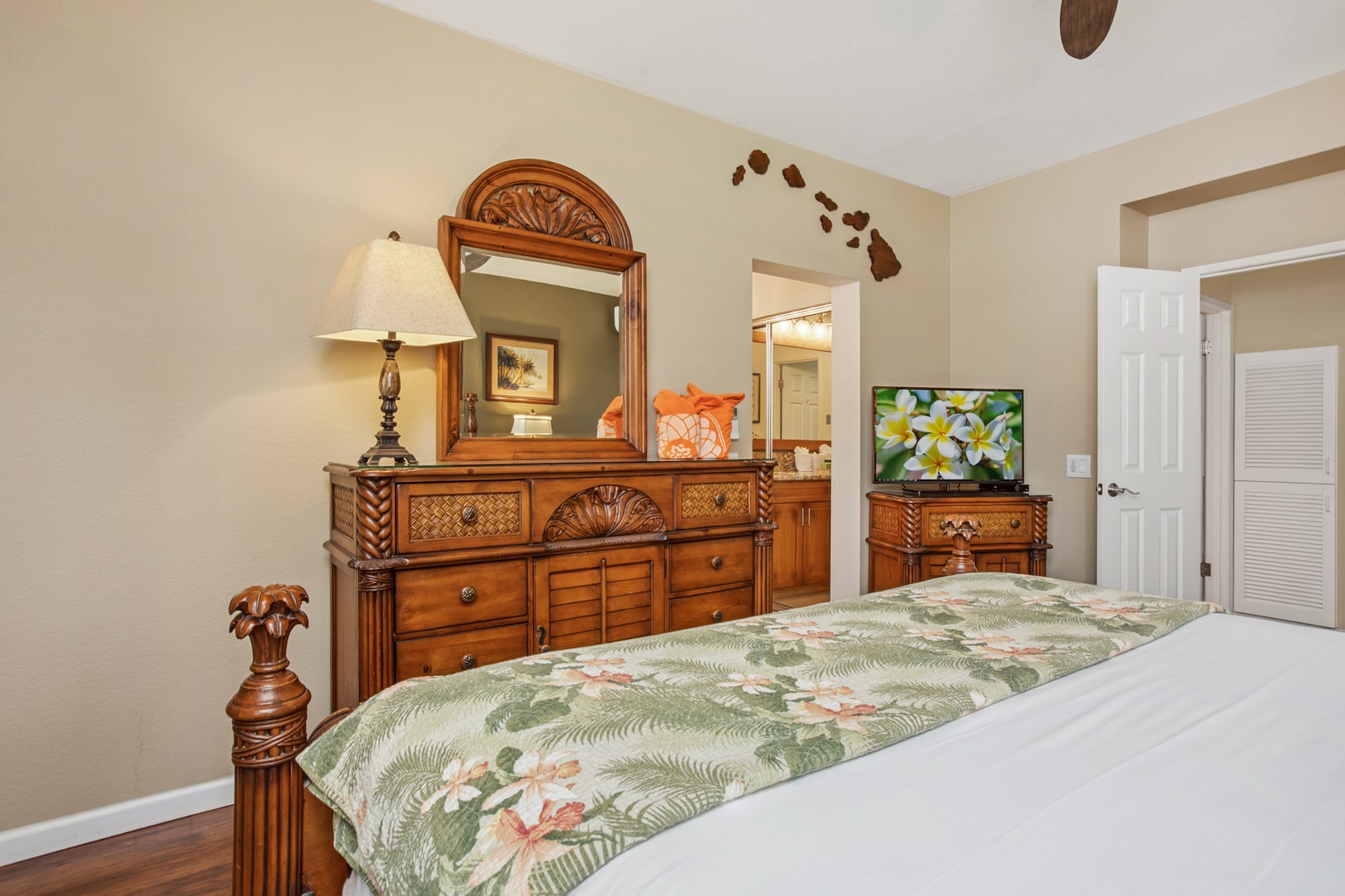 Peaceful master bedroom with large windows and tropical accents