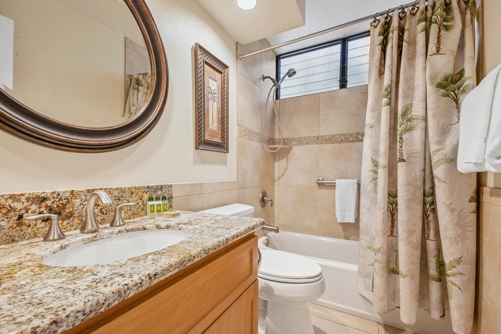 Charming guest bathroom with tropical flair and thoughtful touches