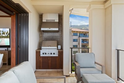 Grill under open skies and unwind in comfort—this lanai blends modern convenience with breezy outdoor relaxation