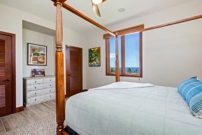 This tropical hideaway’s queen bed stands tall and proud, like a throne for your sweetest sunset dreams