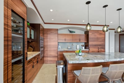 Barstools perch like quiet philosophers, inviting you to muse on mangoes or plot your next surf break