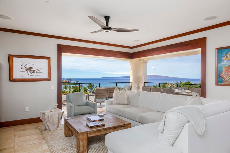 This room whispers “resort chic” with plush clouds for couches and an open invite to sip wine under a pastel sky