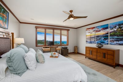 Three wide windows spill golden hour across the bedspread, making this king bed your personal sunrise stage