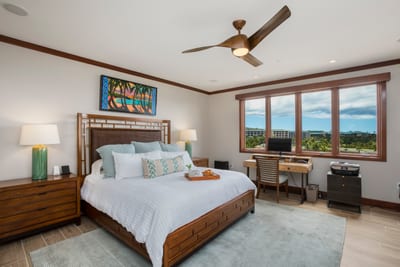 Lounge like royalty in this king-sized bed framed in warm wood, where morning light filters in like a gentle hug