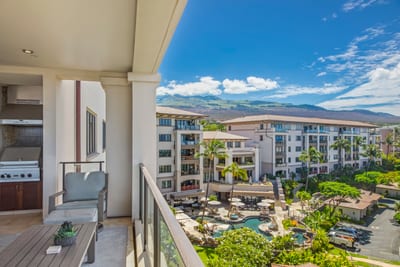 Mountains in the distance, ocean on the horizon, and a poolside kingdom below—this view checks every dream box