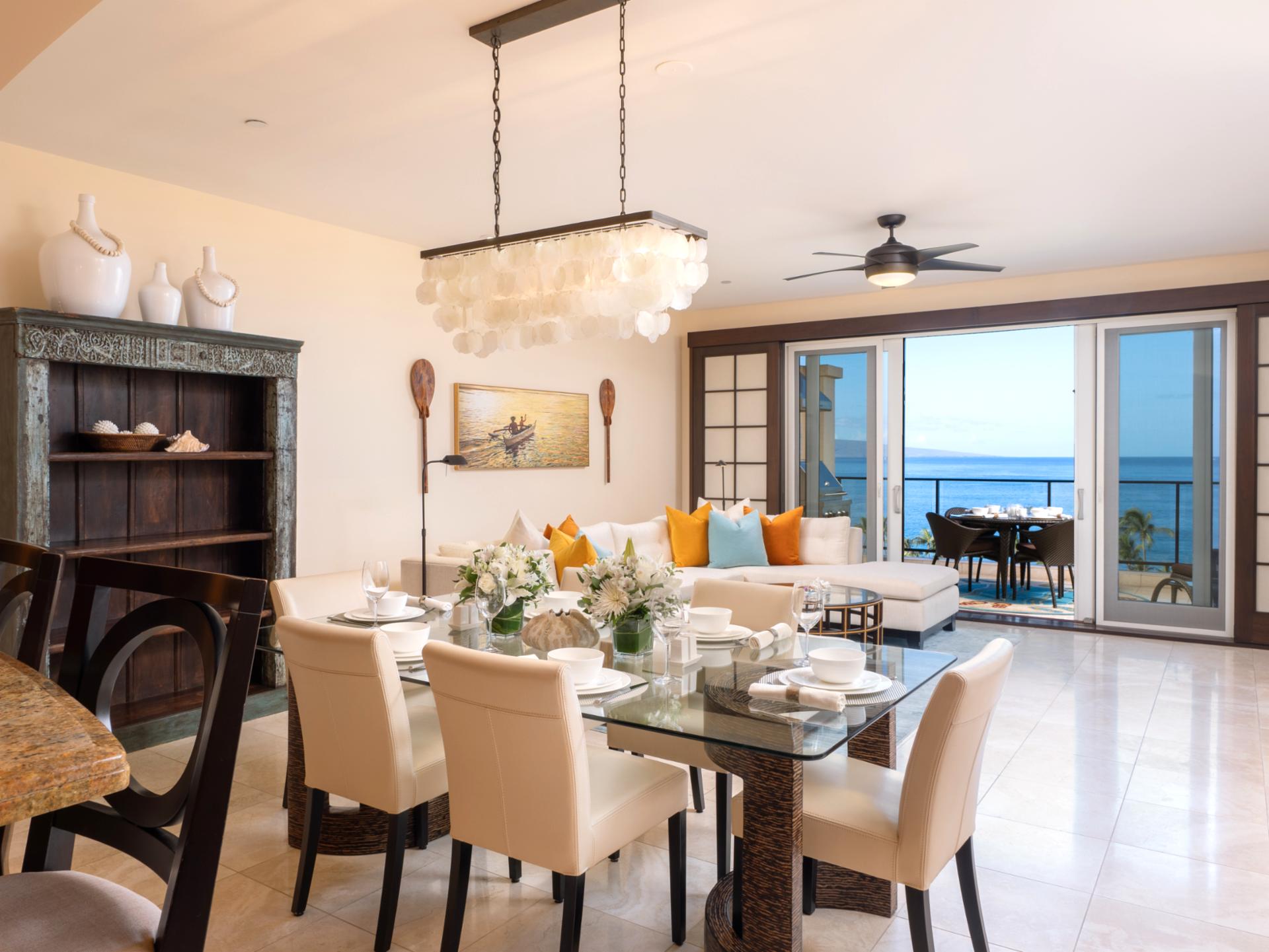 Share dinner and conversation in this open dining space with ocean glimpses in the background.