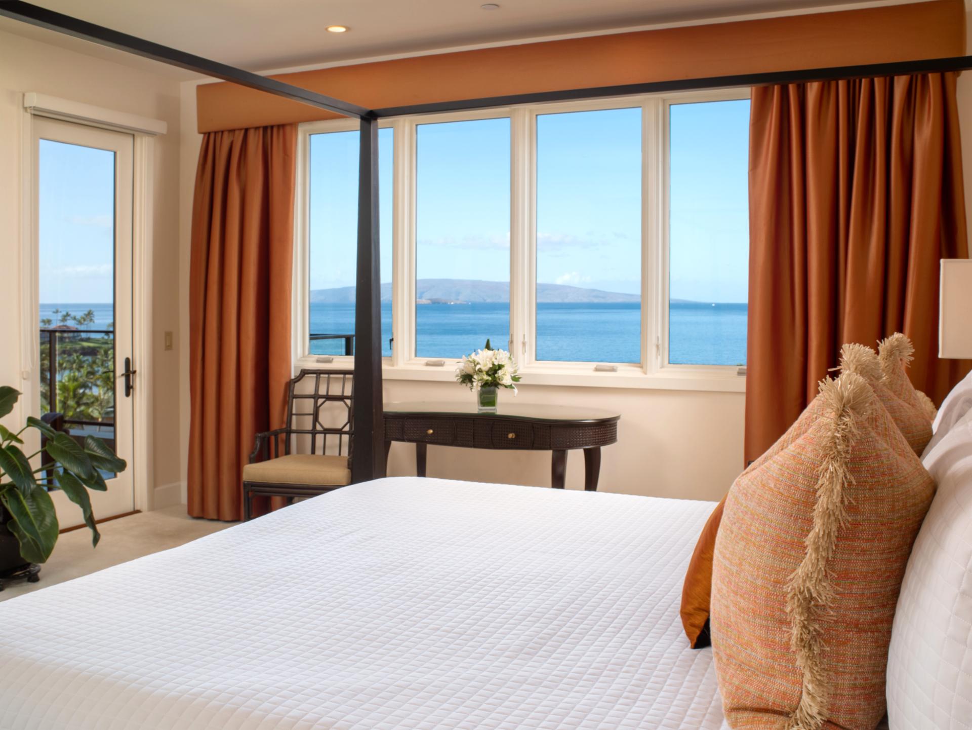 Breezy curtains and island furnishings create a calming retreat with wraparound windows.