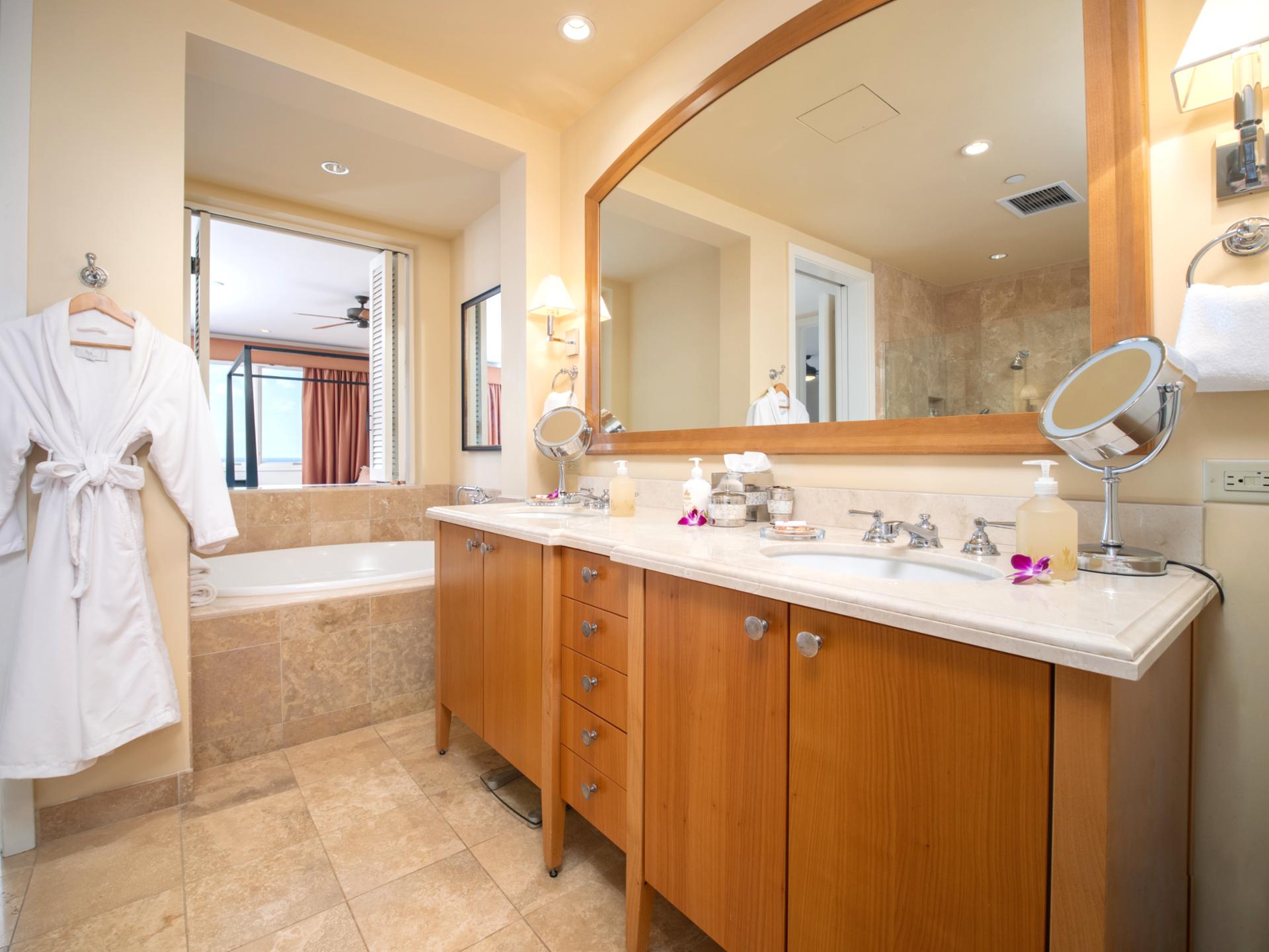Refresh in your spacious bath with soaking tub, walk-in shower, and dual-sink granite vanity.