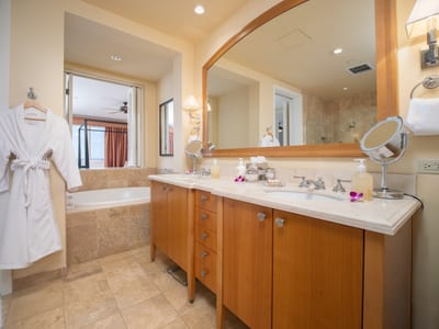 Refresh in your spacious bath with soaking tub, walk-in shower, and dual-sink granite vanity.