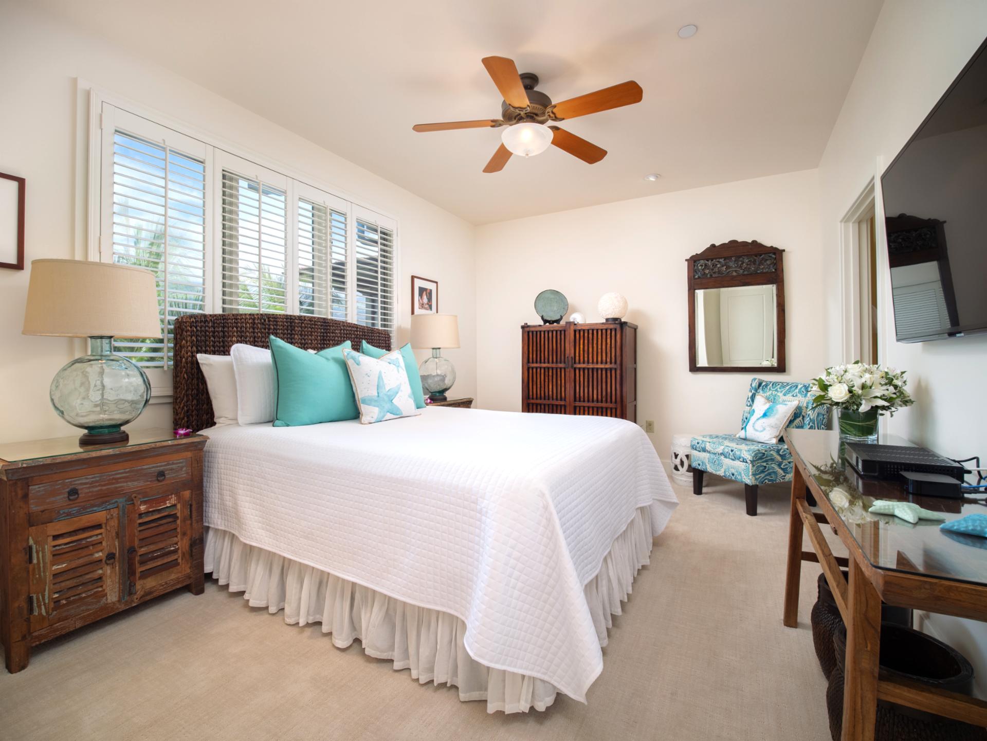 Your third bedroom includes a Queen bed, vintage-inspired furnishings, and a charming garden view desk nook.