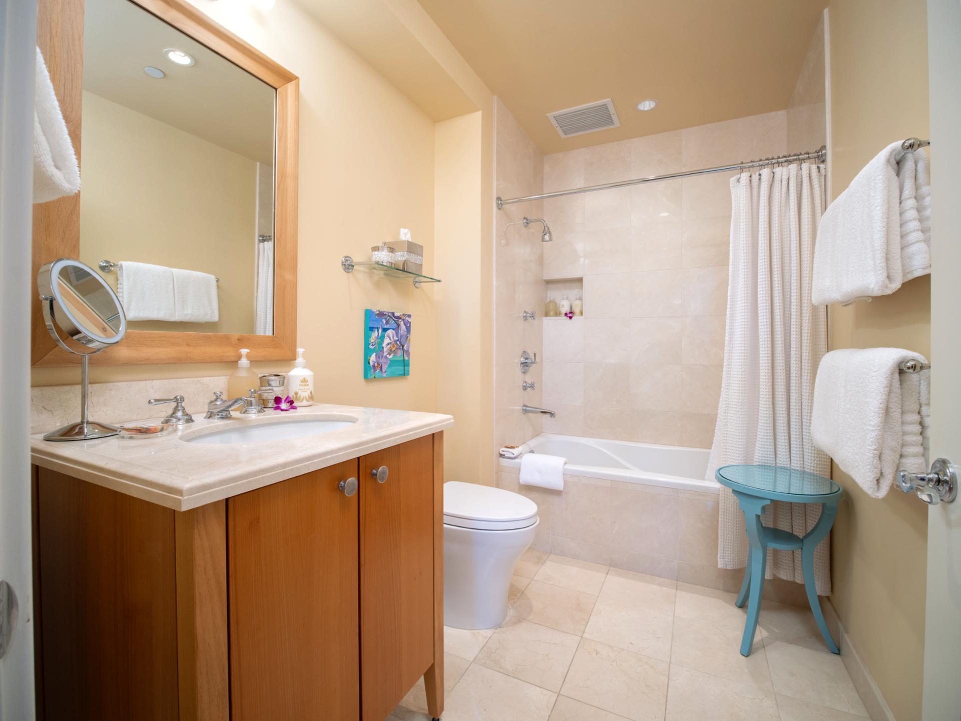 Full bath includes a shower/tub combo, wide vanity, and everything stocked for a comfortable stay.
