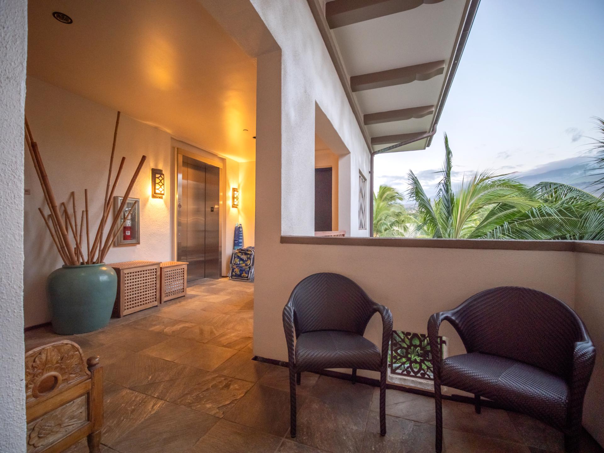 Covered entry patio with seating lets you pause and enjoy the view before heading out.