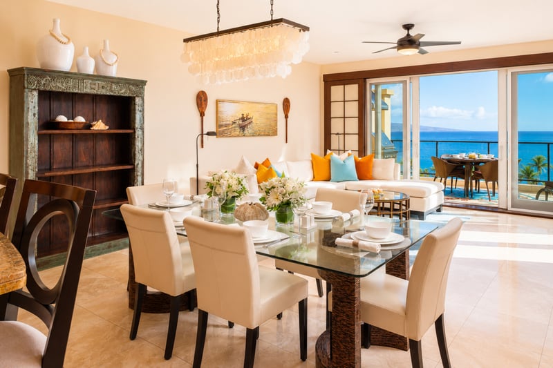 Dining room at Wailea Beach Villas PH505 — capiz shell chandelier over seating for eight with a sunset ocean backdrop WBV-PH505