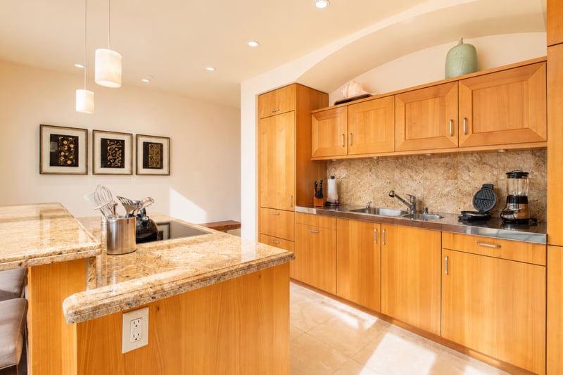 Kitchen prep station at Wailea Beach Villas PH505 — stainless sink, built-in double oven, and full small-appliance suite WBV-PH505