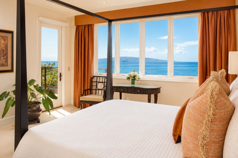 Primary bedroom at Wailea Beach Villas PH505 — four-poster canopy bed with an unobstructed ocean and island view through the picture windows WBV-PH505