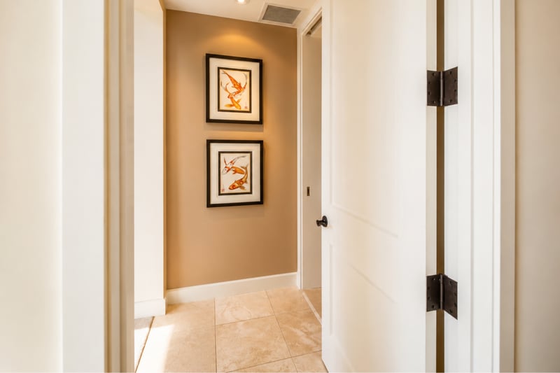 Hallway art nook at Wailea Beach Villas PH505 — a pair of framed koi fish prints add a serene coastal touch WBV-PH505