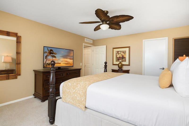 A tropical sunrise glows from the flat-screen TV, perfectly viewable without ever leaving your plush king bed