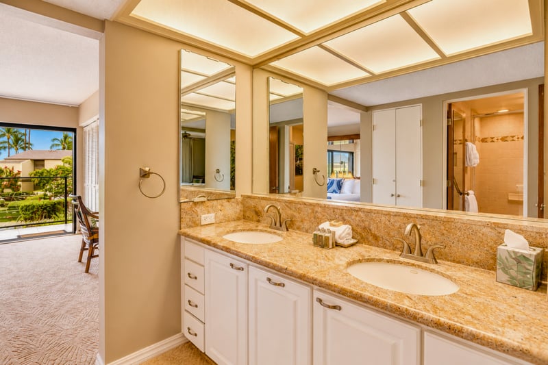 Primary bathroom with dual vanity and generous counter space.