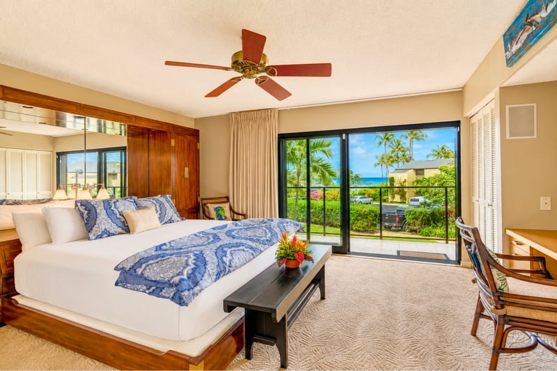 Wake up to tropical views from the spacious primary suite.