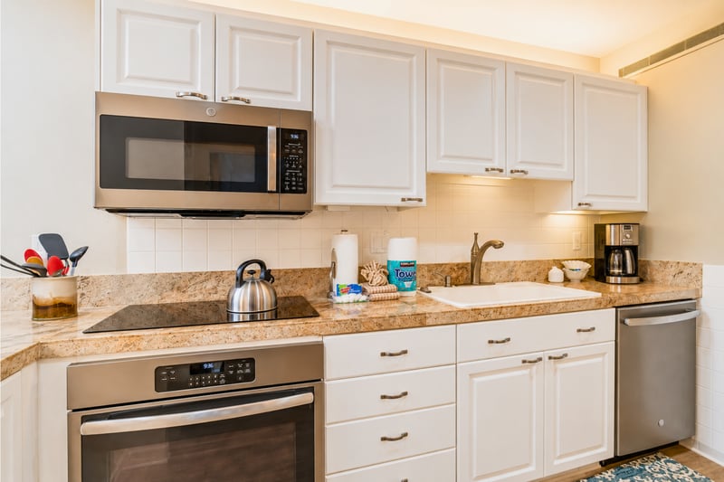 Fully equipped kitchen with modern appliances and ample space.