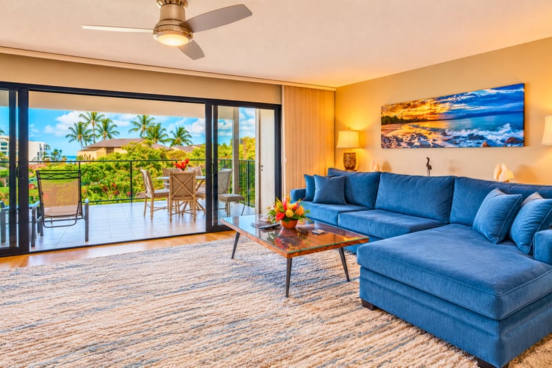 Spacious living area featuring comfortable seating and natural light.