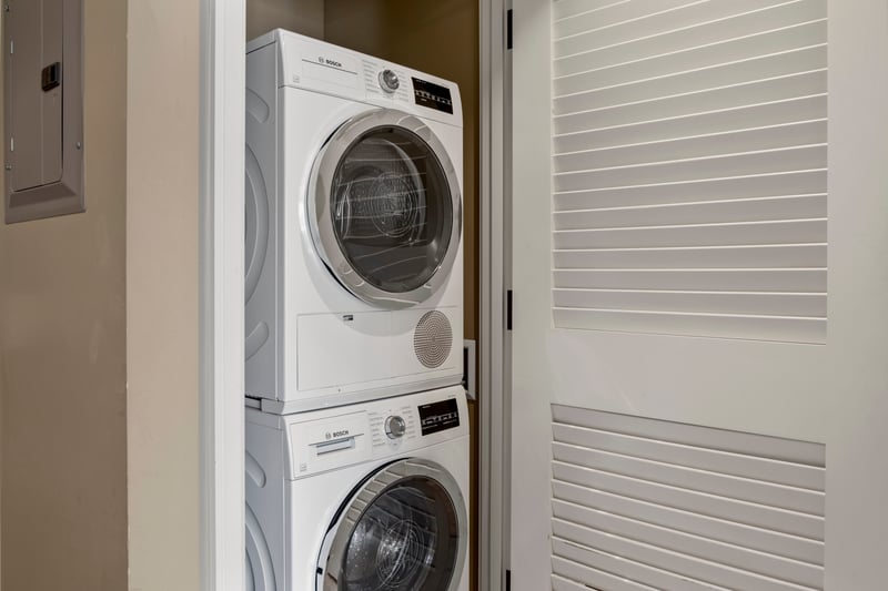 A stacked washer and dryer inside your residence adds everyday convenience, letting you keep beachwear fresh during longer island stays. HKK-537