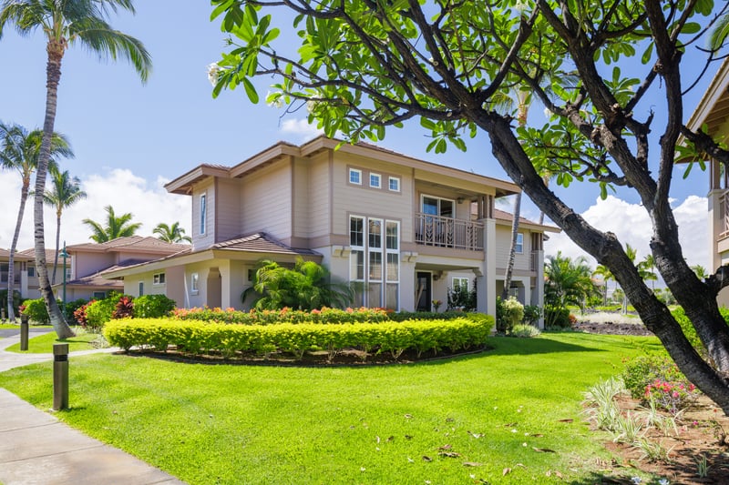 Your serene escape: cozy patio, breezy palms, and perfect blue skies