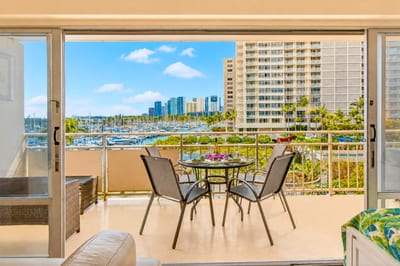 Spacious balcony dining with resort and ocean views