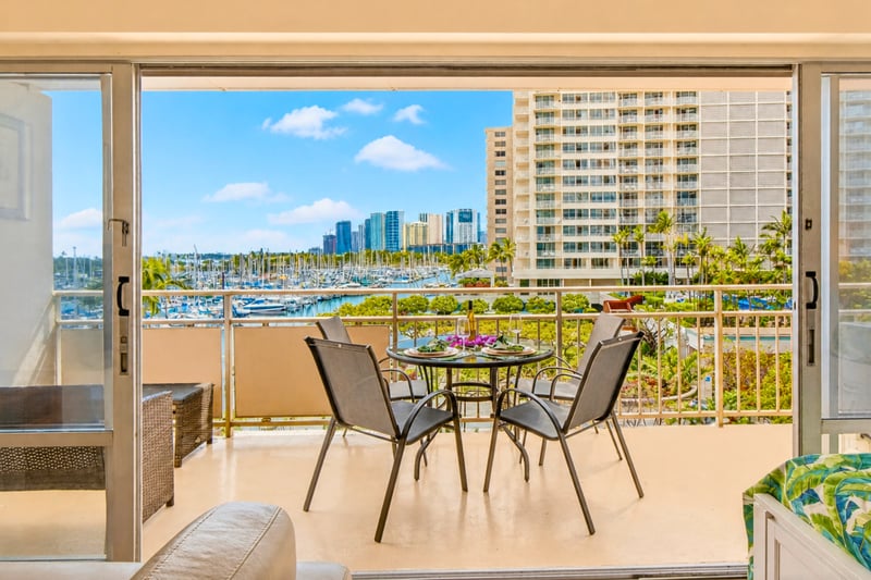 Spacious balcony dining with resort and ocean views