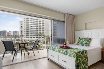 Spacious bedroom area featuring island-inspired décor and natural light.