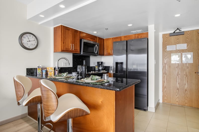 Modern kitchen featuring ample counter space and full-size appliances. ILK-437