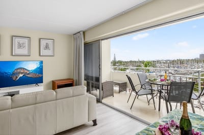 Bright, open living space with floor-to-ceiling windows and stunning ocean views.