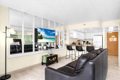 Spacious living area featuring comfortable seating, modern finishes, and a welcoming Hawaiian resort atmosphere