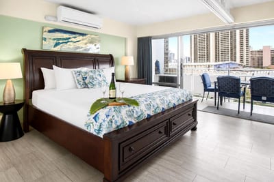 The suite features a king size bed and hotel grade, luxury linen sheets