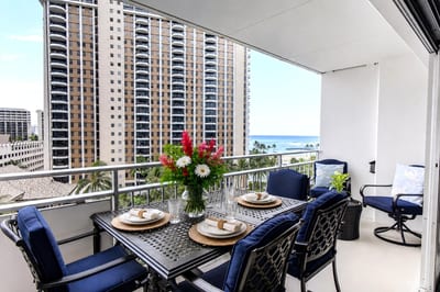 Relax on your private lanai at Ilikai Resort & Spa with outdoor dining, tropical breezes, and views toward the Pacific